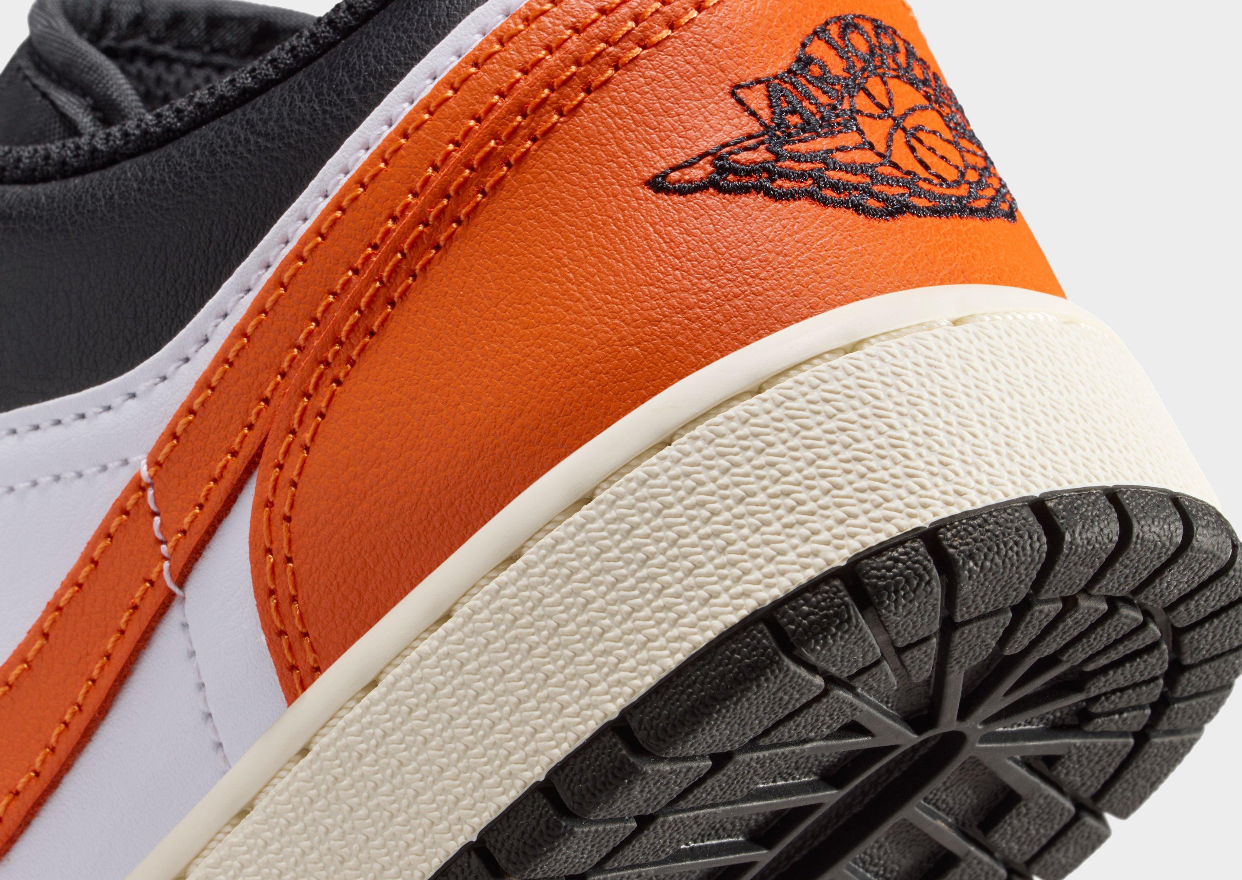 orange jordans junior